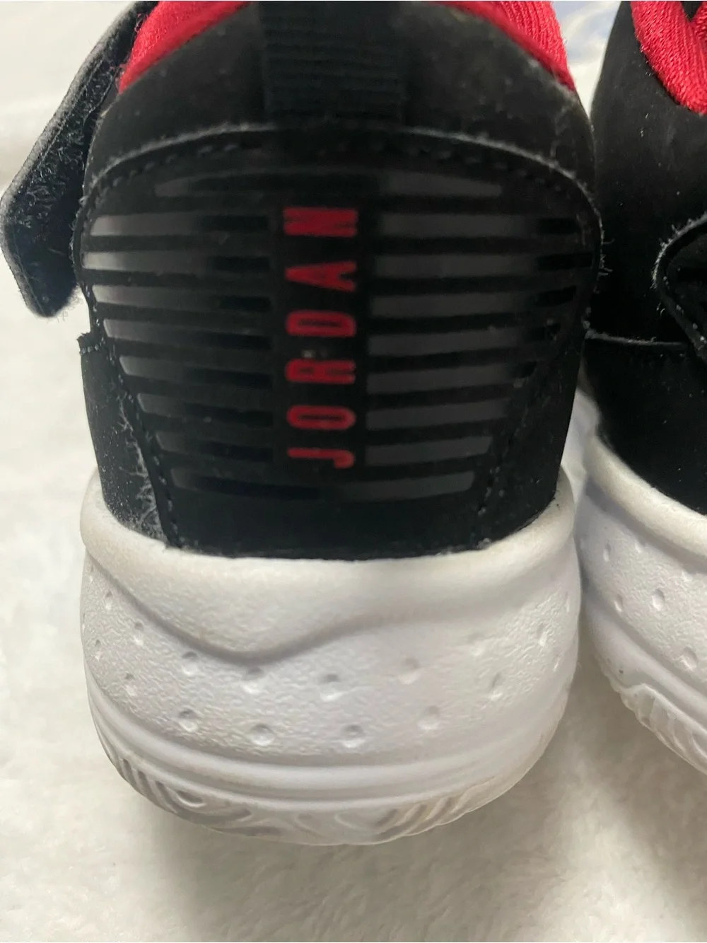 Jordan Kids Black and Red High-Top Sneakers